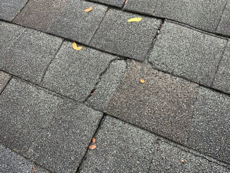 Cracked Roofing Shingles in Michigan scaled